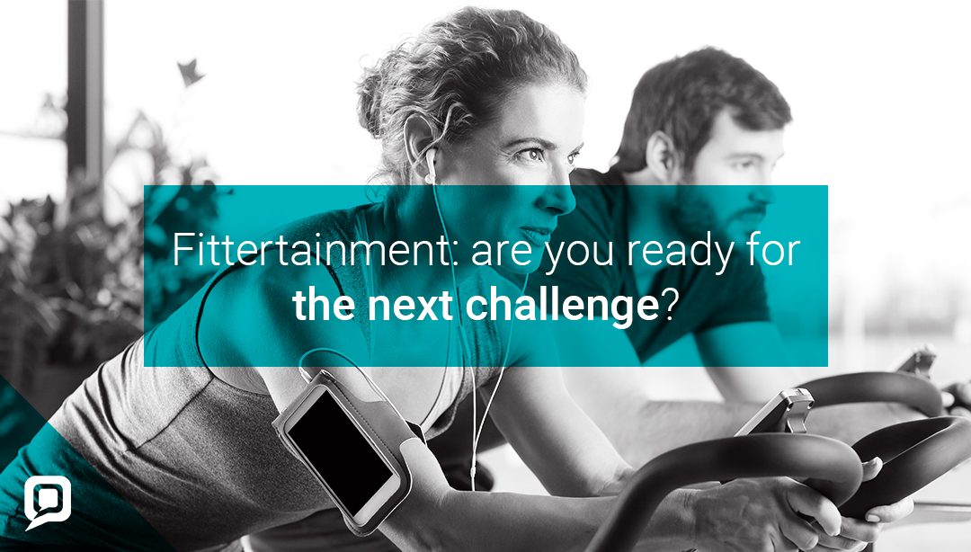 Black and white image of man and woman on exercise bikes with 'Fittertainment: are you ready for the next challenge?' written over it